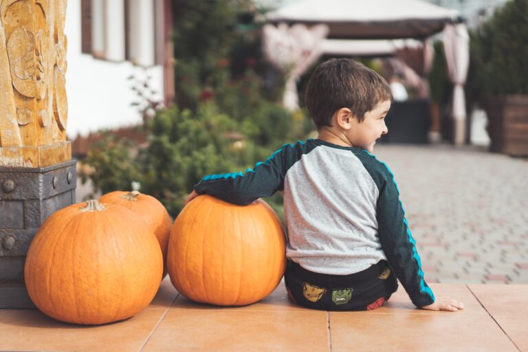 child with pumpkin